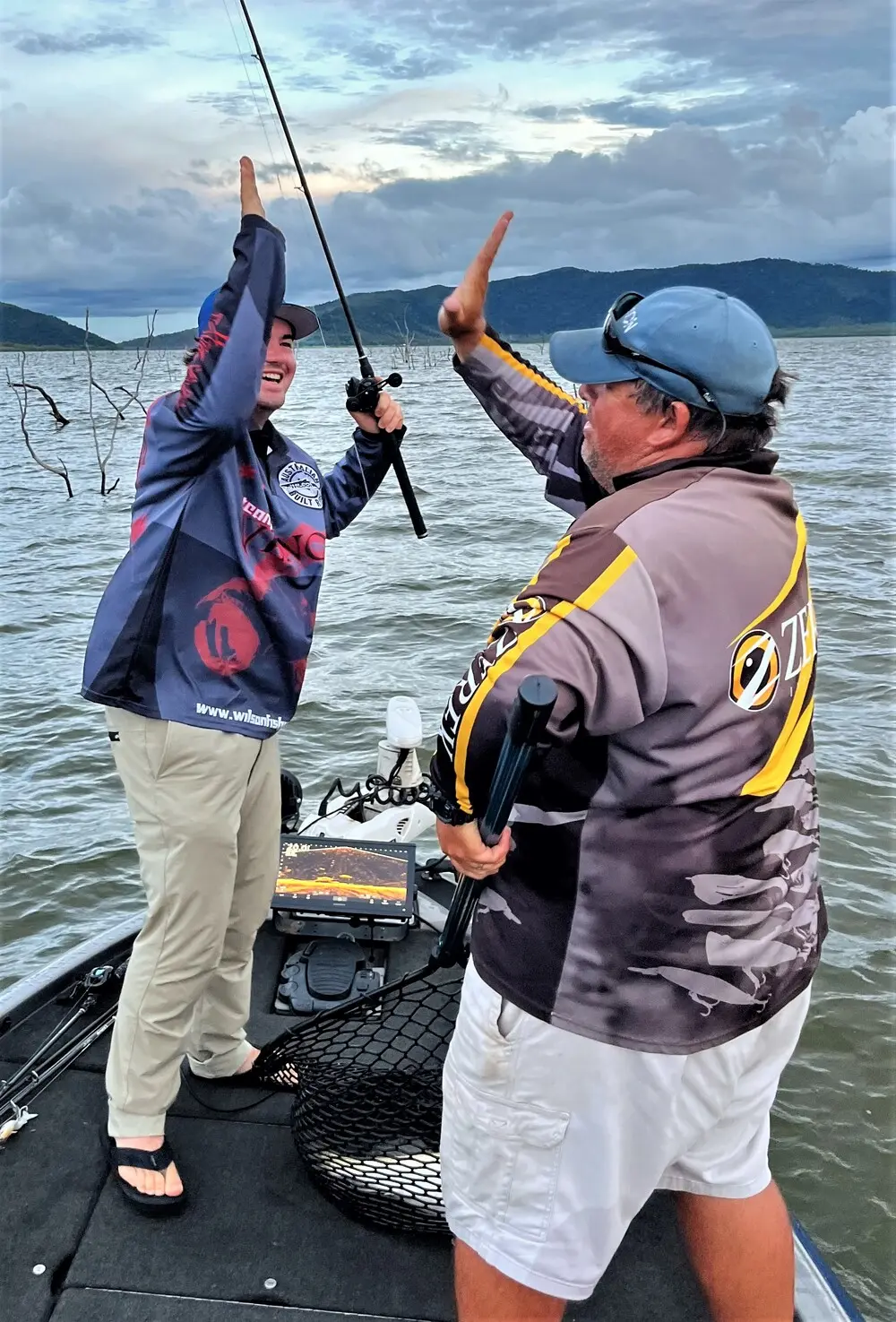Cameron Hall getting his first barra in the net and high fives all round!