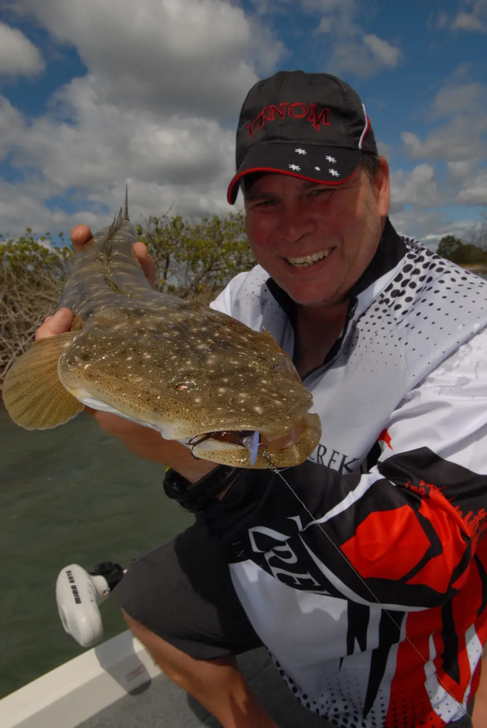 Kord looks pretty pleased with this BL coloured Tango Shad munching flathead.