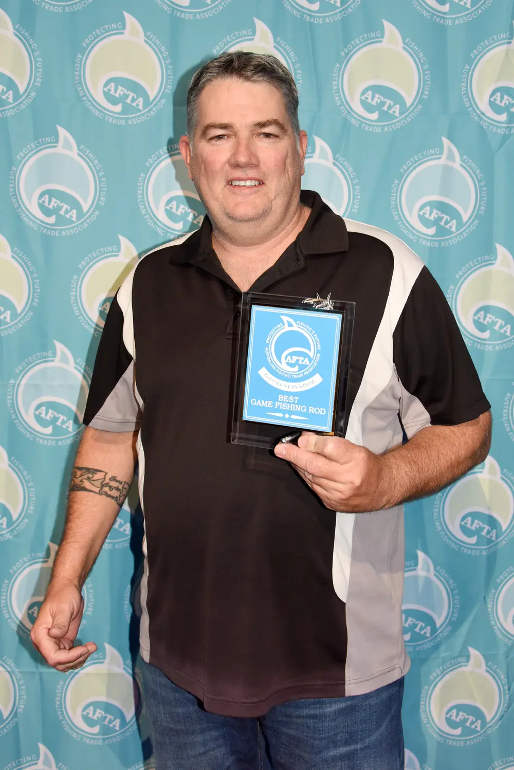 Venom Ocean Warrior wins - Rod Brand Manager Clint with the award